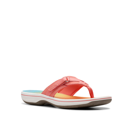 Coral flip-flop sandal with adjustable hook-and-loop straps.