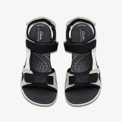 Pair of sandals with black straps, white and gray trim.