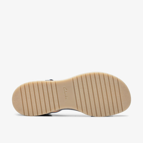 Sandal with a tan ridged sole.