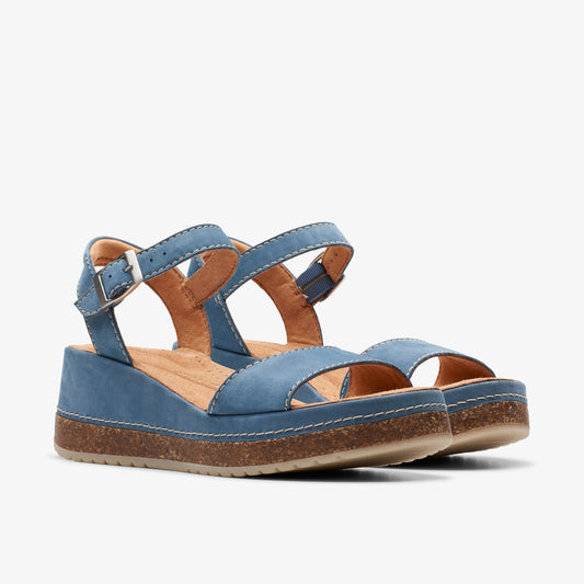 Pair of blue leather wedge sandals with buckled ankle straps.