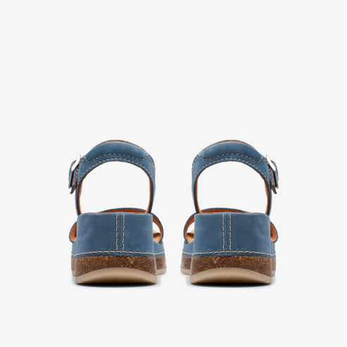 Back view of blue leather open toe sandals with an ankle strap and a cork sole.