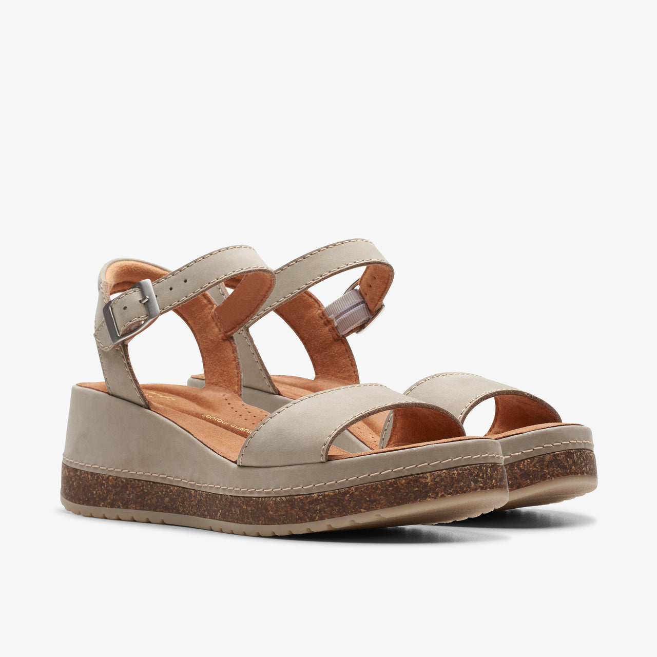 Beige platform sandals with an ankle strap.