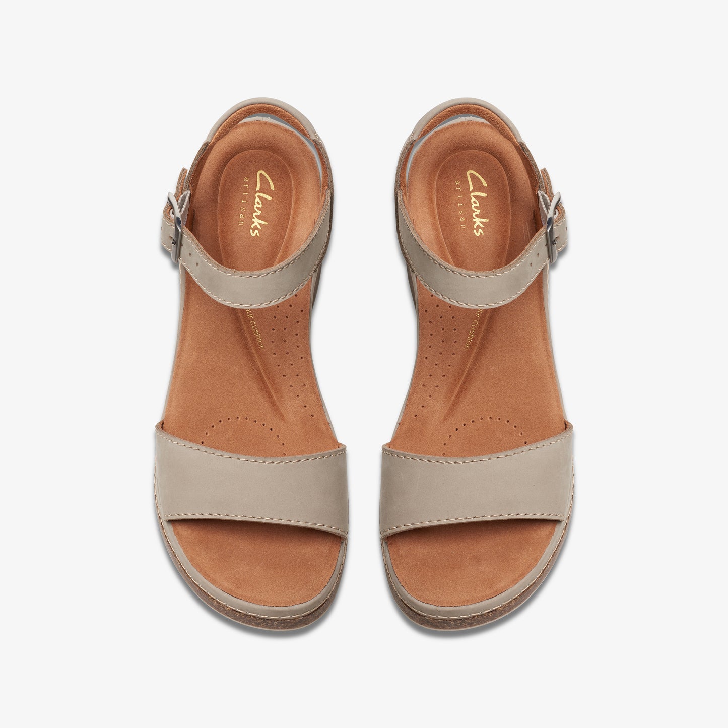 Top-down view of two beige-colored Clarks sandals, each with a buckled ankle strap and wide toe strap.