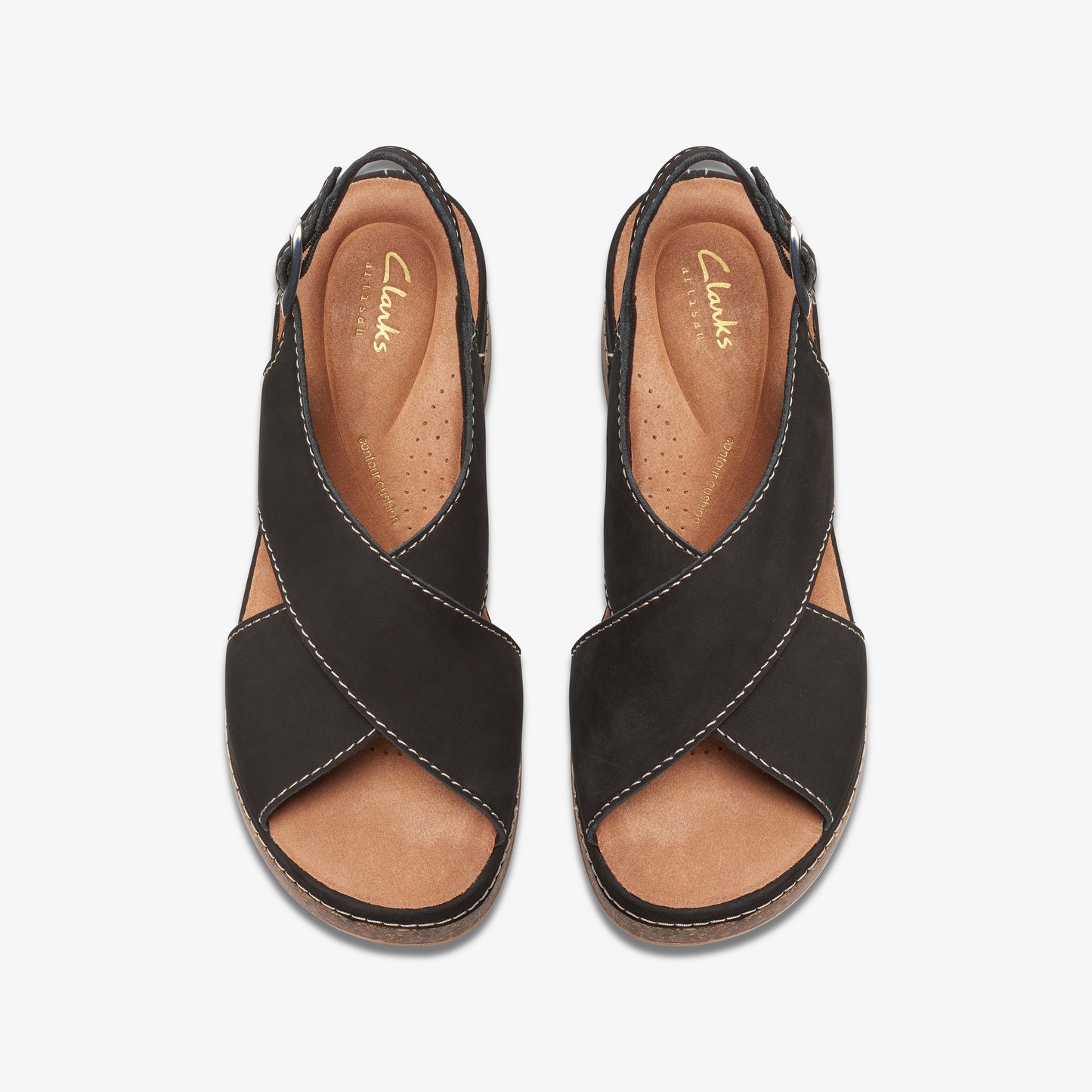 Overhead view of black open-toe sandals with crossing straps.