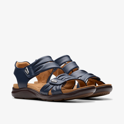 Pair of navy blue sandals with hook and loop closures.