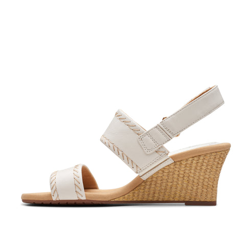 White wedge sandal with braided trim.
