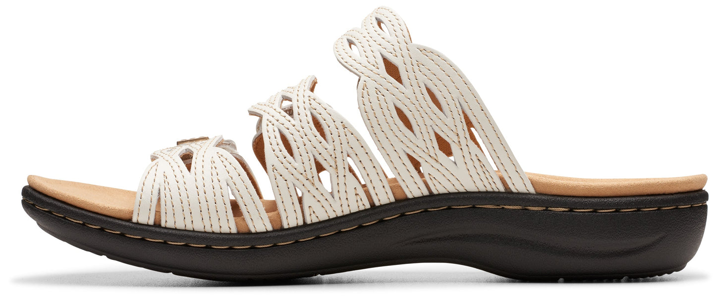 A sandal with a white open-weave upper and a dark sole.