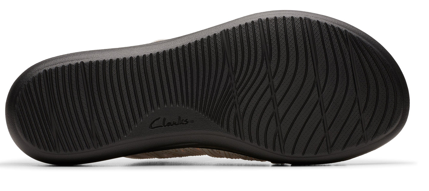 Close-up of the sole of a shoe, showing the black ribbed texture and the word 'Clarks' printed into it.