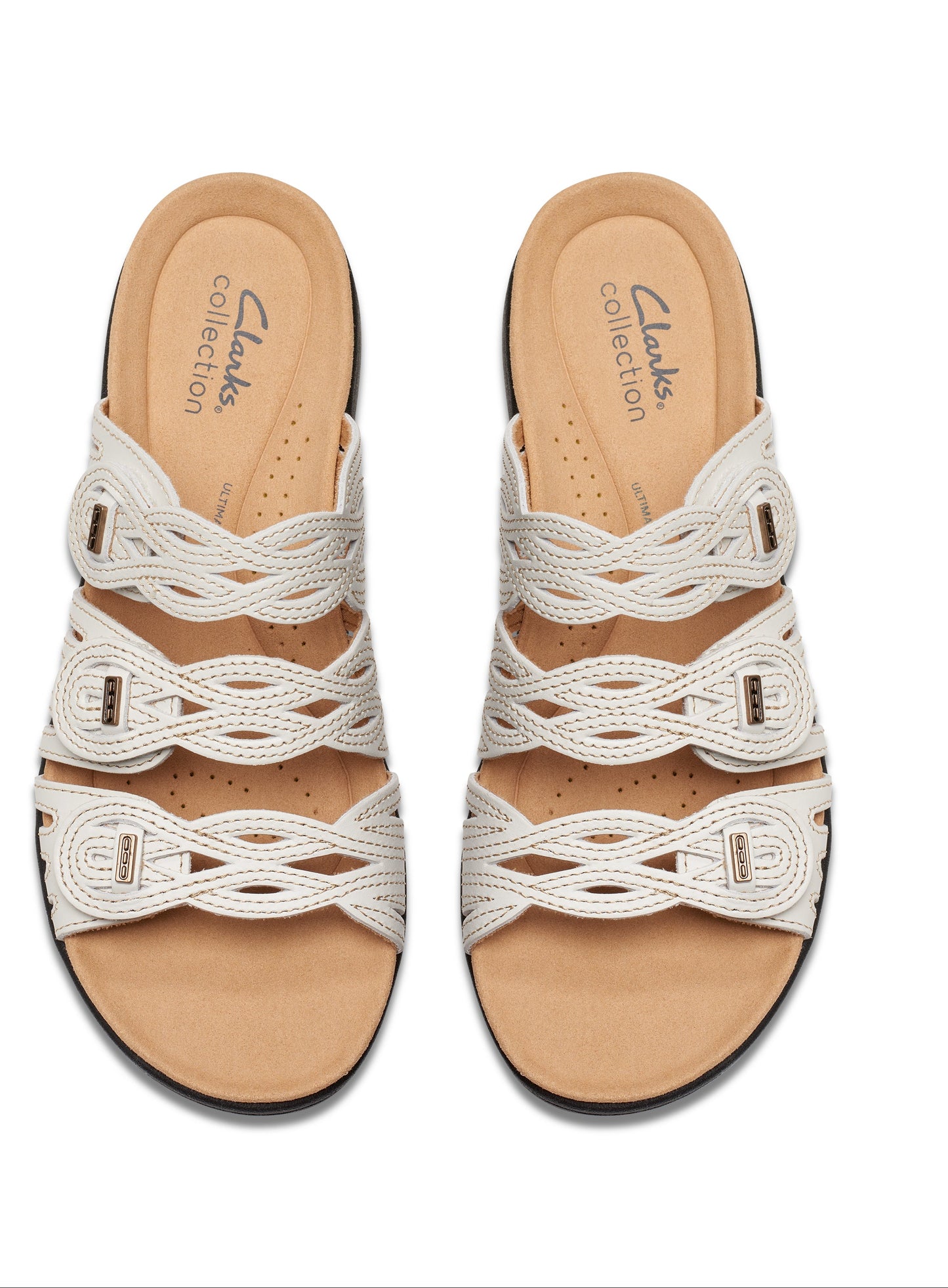 Top-down view of two identical ivory-colored, slip-on sandals with an interwoven strap design and light tan soles.