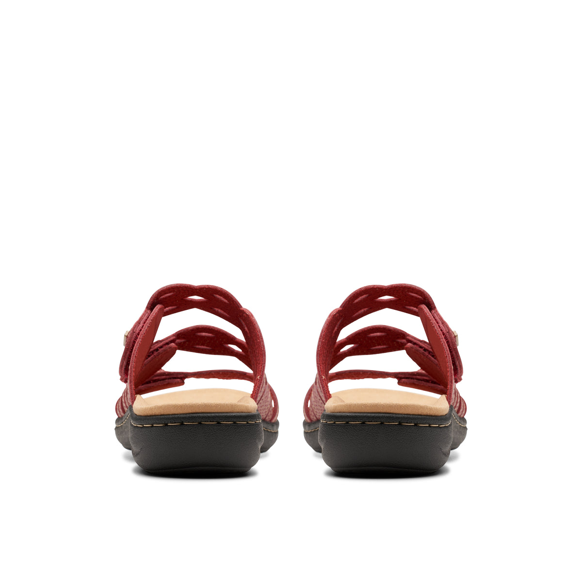 Rear view of two red sandals with adjustable straps, showing stacked midsoles and treaded soles.