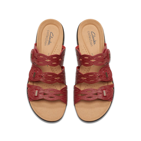 Pair of red sandals with three braided straps, "Clarks collection" on footbed.