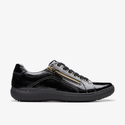 Black patent leather sneaker with gold side zipper and lace-up front.