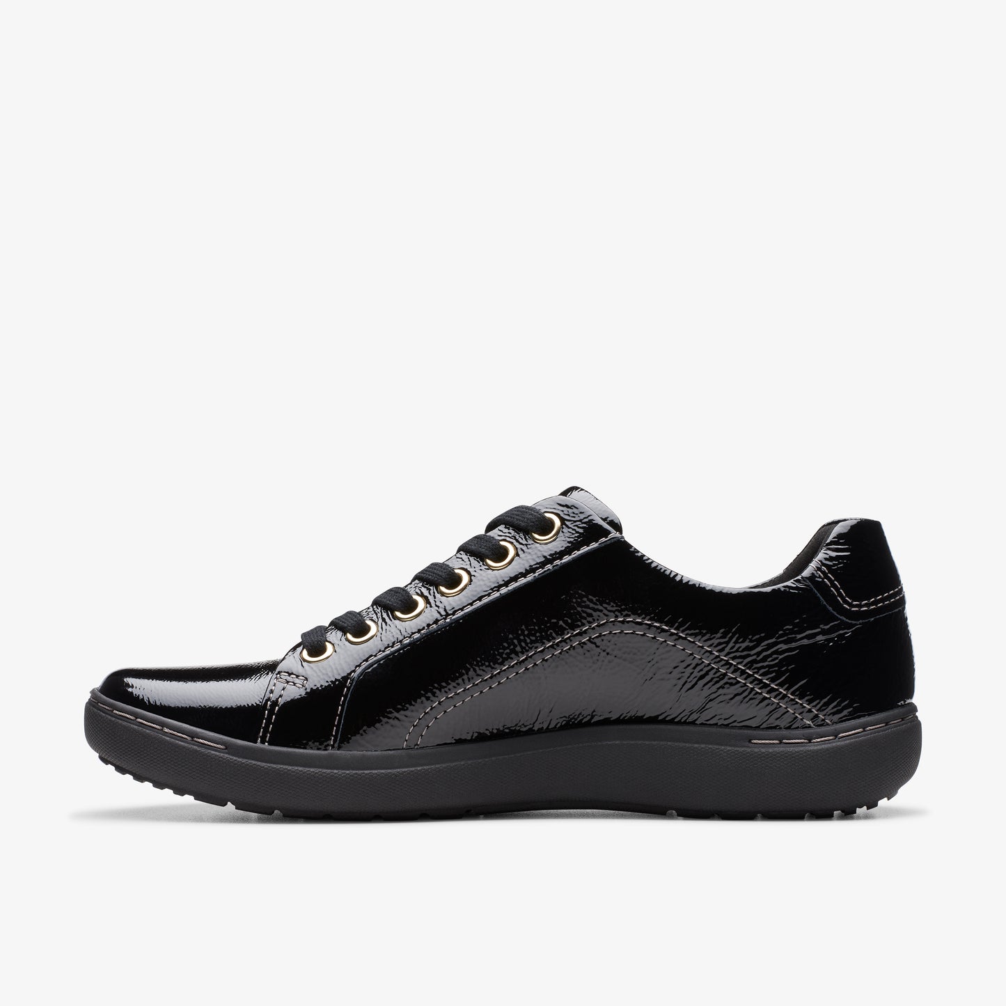 Side view of a black patent leather sneaker with black laces and a dark sole.