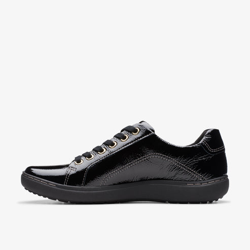 Side view of a black patent leather sneaker with black laces and a dark sole.