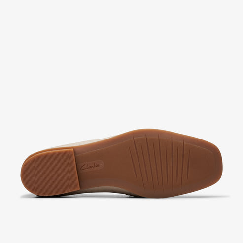 tan shoe sole with ribbed tread