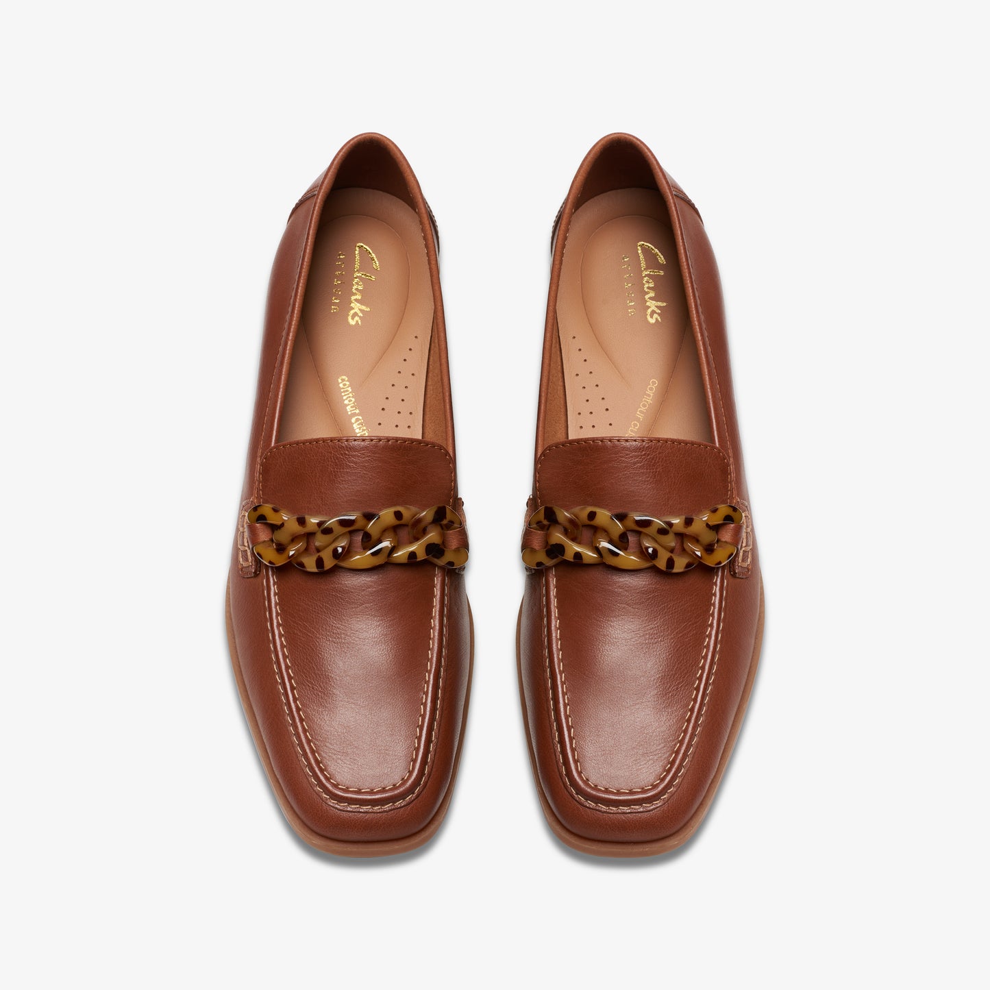 Pair of brown leather loafers with decorative tortoiseshell chains across the vamp.