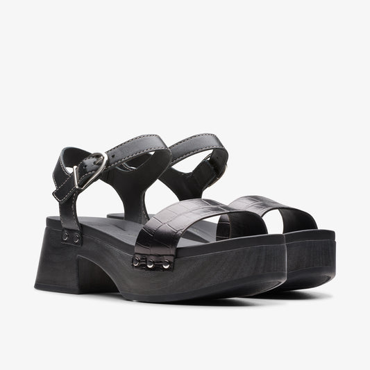 Black heeled platform sandals with a buckle strap and crocodile-print strap.