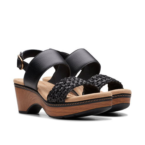 Black wedge sandals with woven strap and ankle strap.