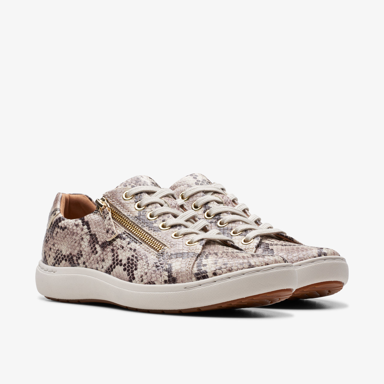 Low-top beige snake-skin sneakers with side zipper and white laces.