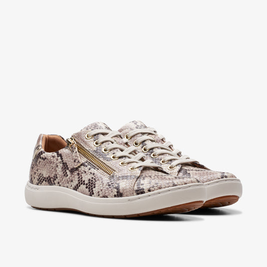 Low-top beige snake-skin sneakers with side zipper and white laces.