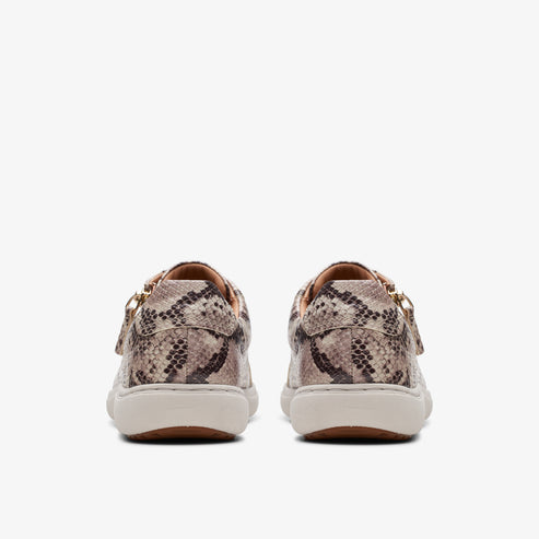 Rear view of low-top sneakers with a snakeskin pattern.
