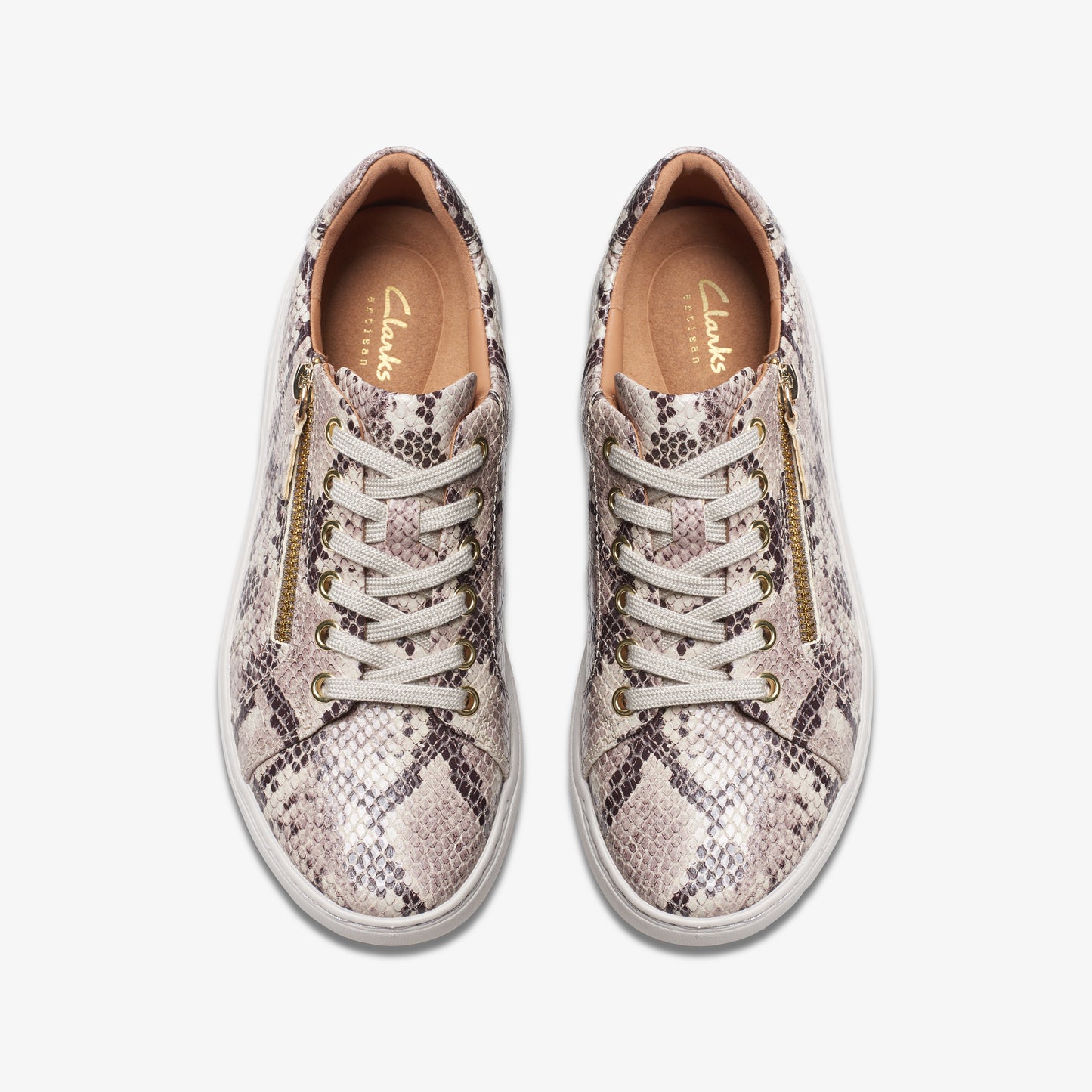 Overhead view of two snakeskin patterned lace-up shoes with gold zippers on either side.