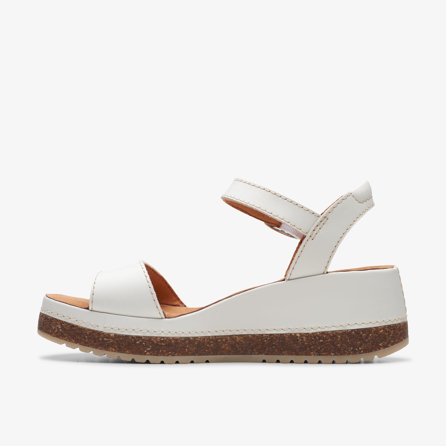 White platform sandal with two straps, one over toes, the other around the ankle.