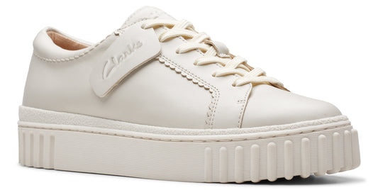 Off-white leather sneaker with matching laces and a thick, ridged sole.