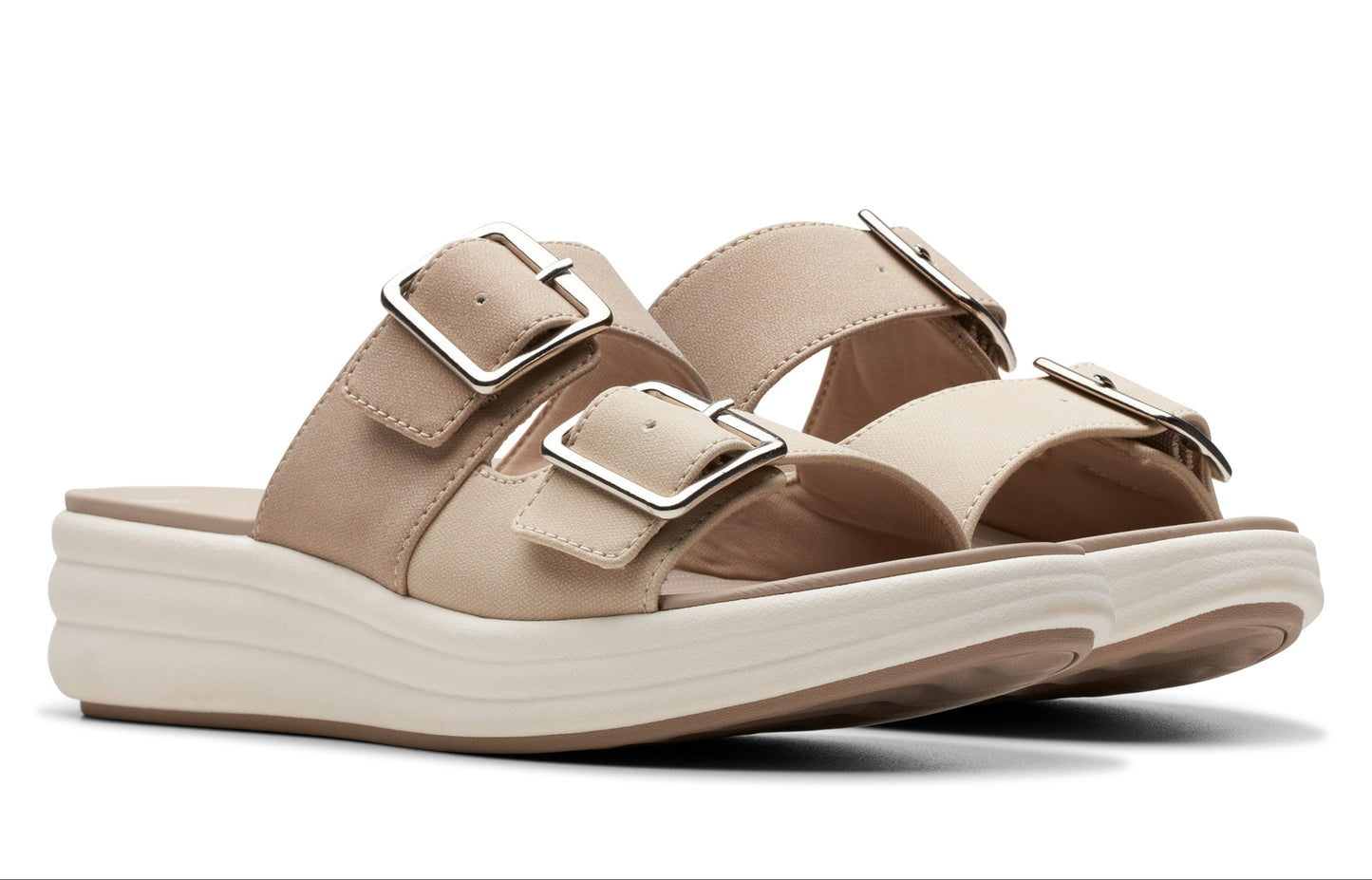 Pair of beige platform sandals with silver buckles.