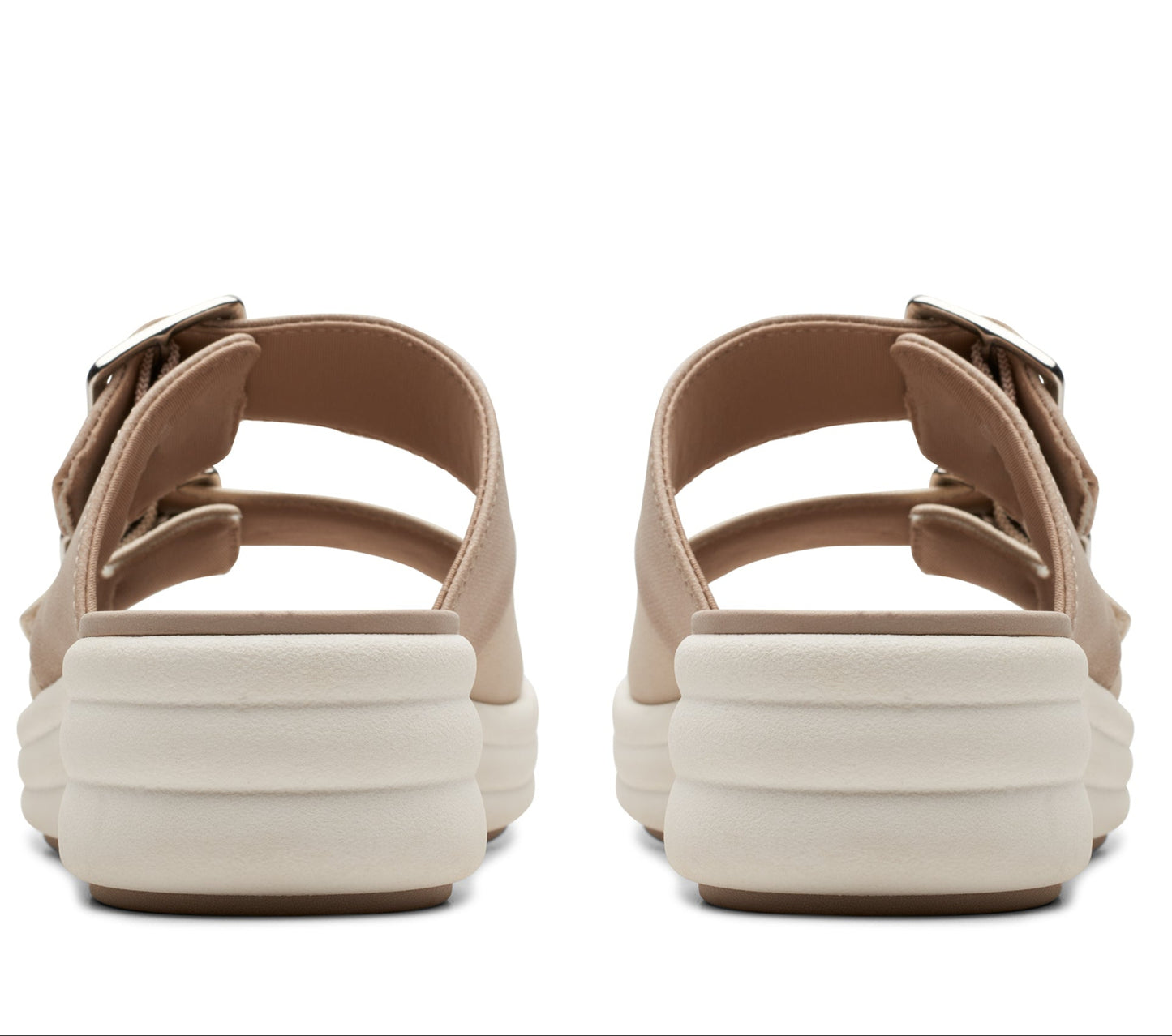 Pair of tan platform sandals with double straps and silver buckles, viewed from the back.
