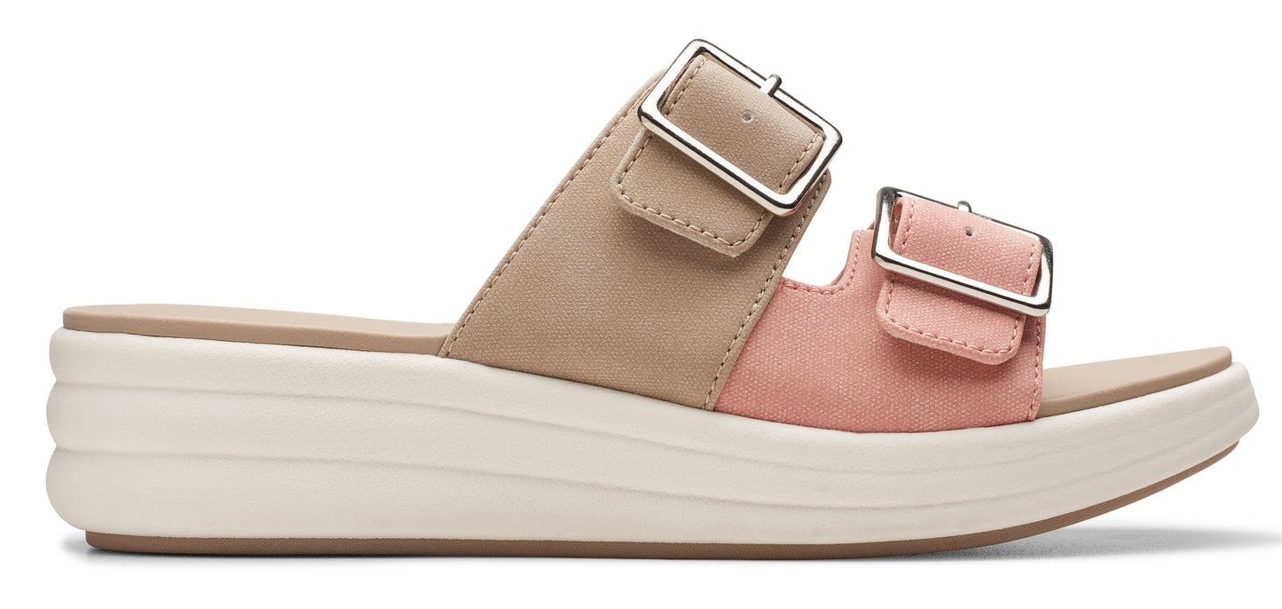 Two-tone slide sandal with two straps, each having a silver buckle and a platform sole.
