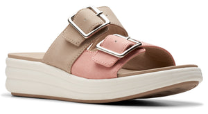 Slip-on sandal featuring two adjustable buckle straps, a beige upper strap, a light-pink lower strap, and a white platform sole.
