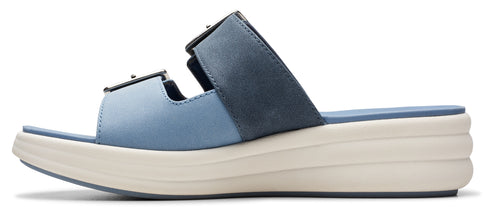 Blue sandal with a thick white sole and buckle straps.