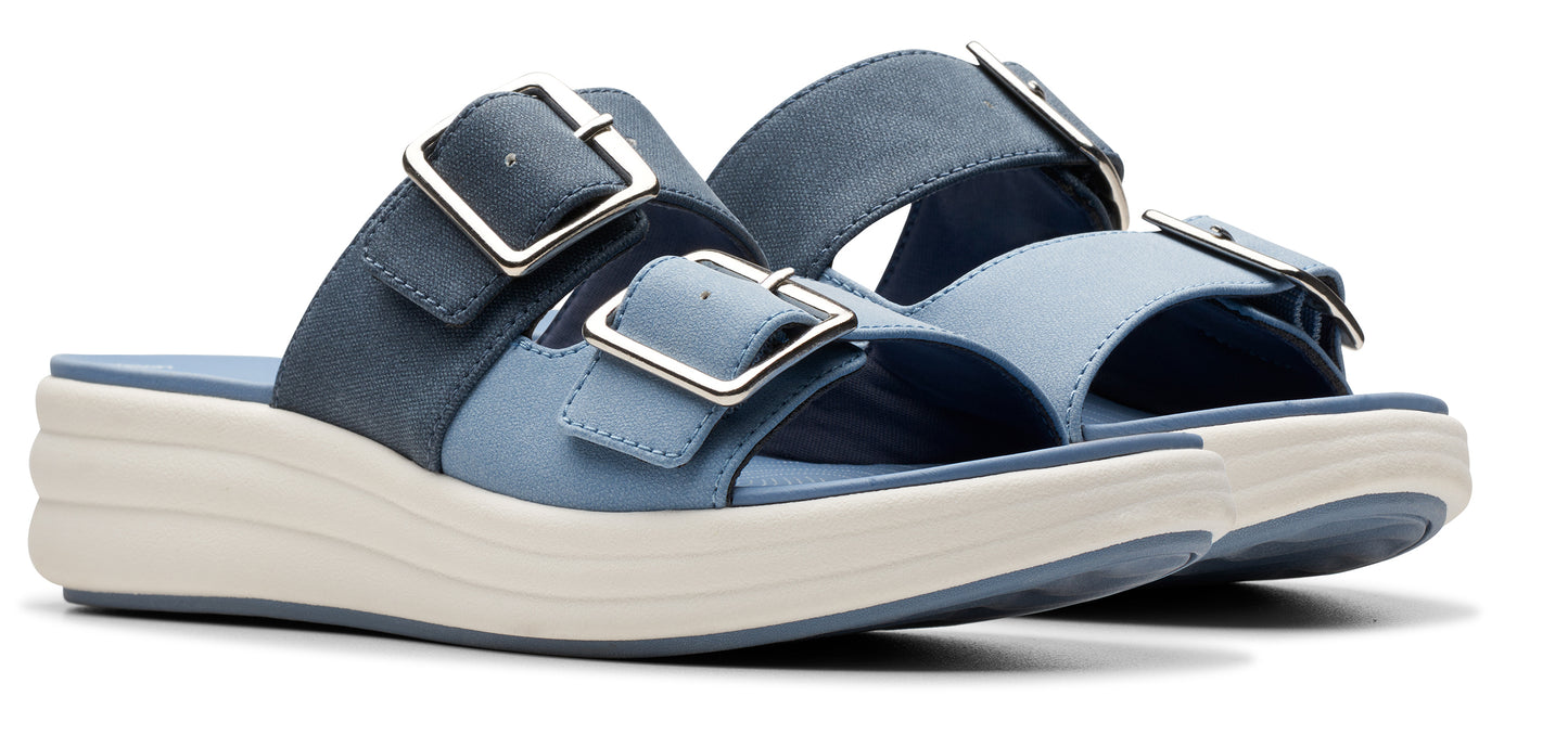 Two blue sandals with silver buckles.