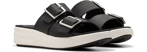 Black platform sandals with silver buckles.