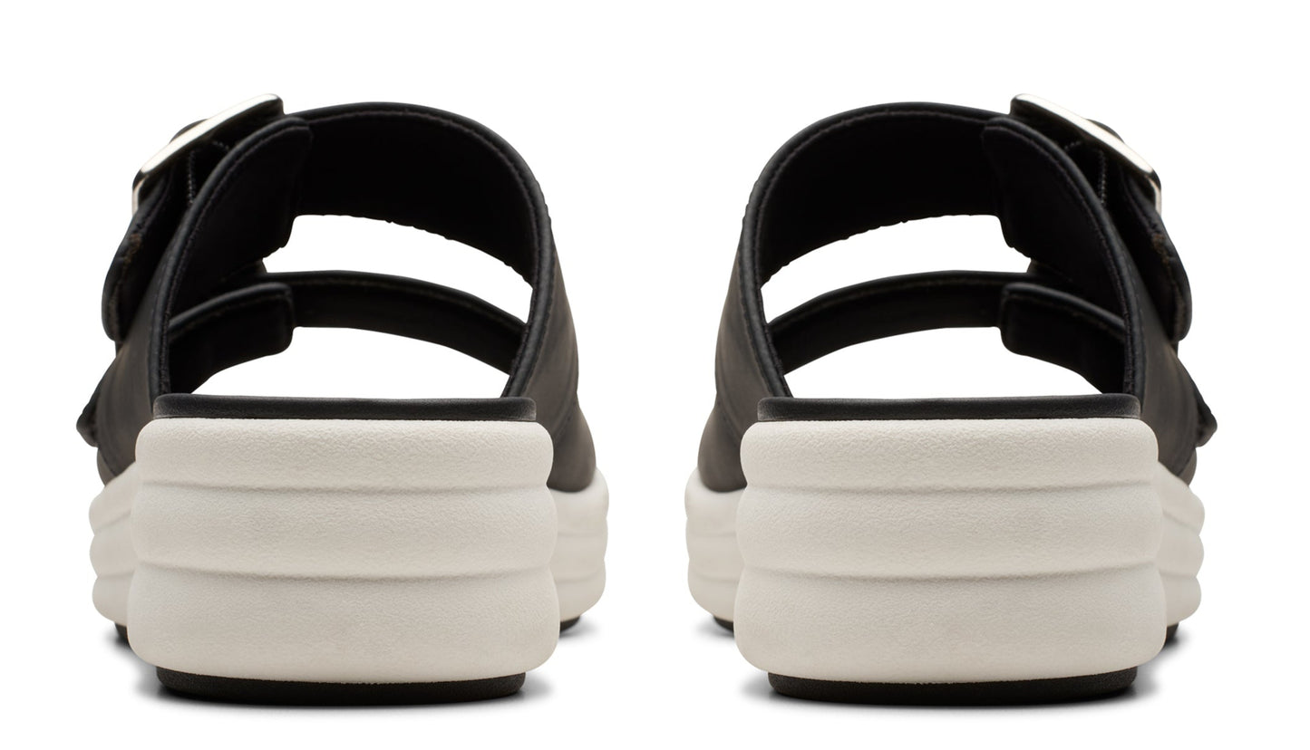 Pair of black platform sandals with two straps and silver buckles.