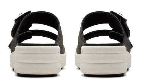 Pair of black platform sandals with two straps and silver buckles.