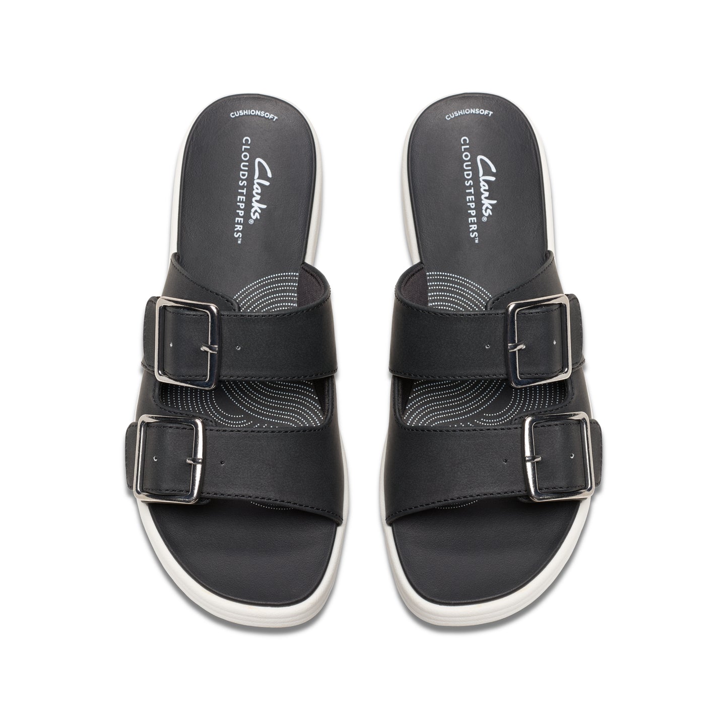 Two identical black slides with two silver buckles each and white soles, as viewed from above.