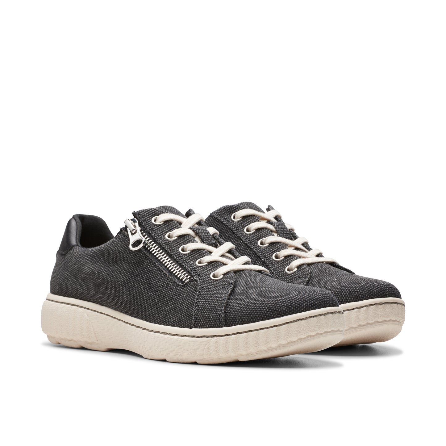 A pair of black canvas sneakers with side zippers and white laces.