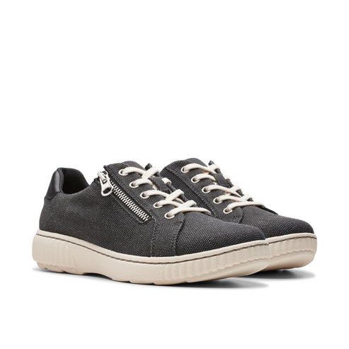 A pair of black canvas sneakers with side zippers and white laces.