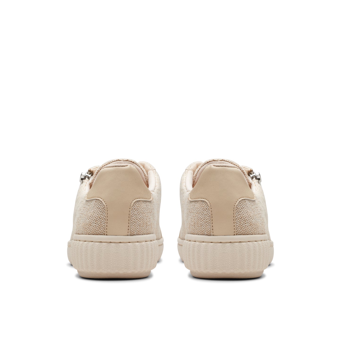 Beige low top sneakers, rear view.