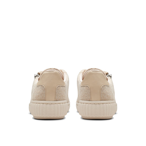 Beige low top sneakers, rear view.