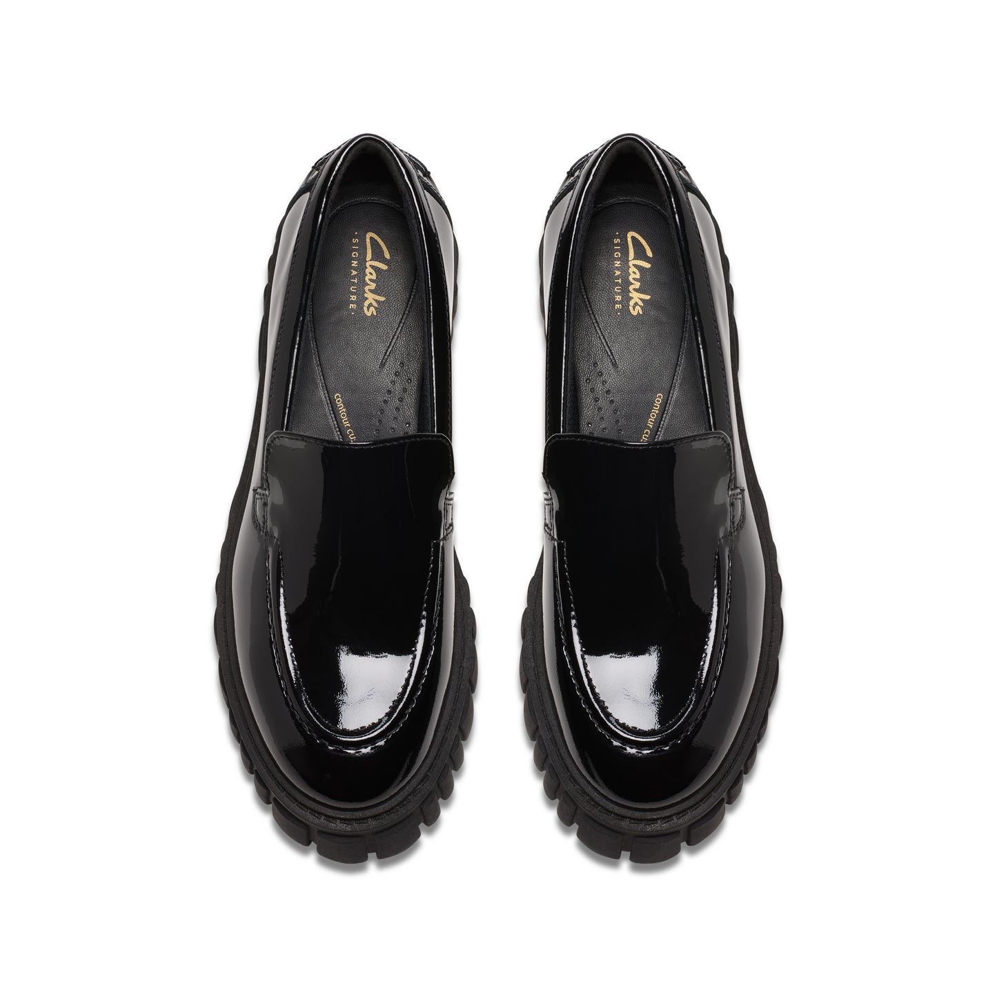 Top-down view of shiny black loafers with thick, textured soles.