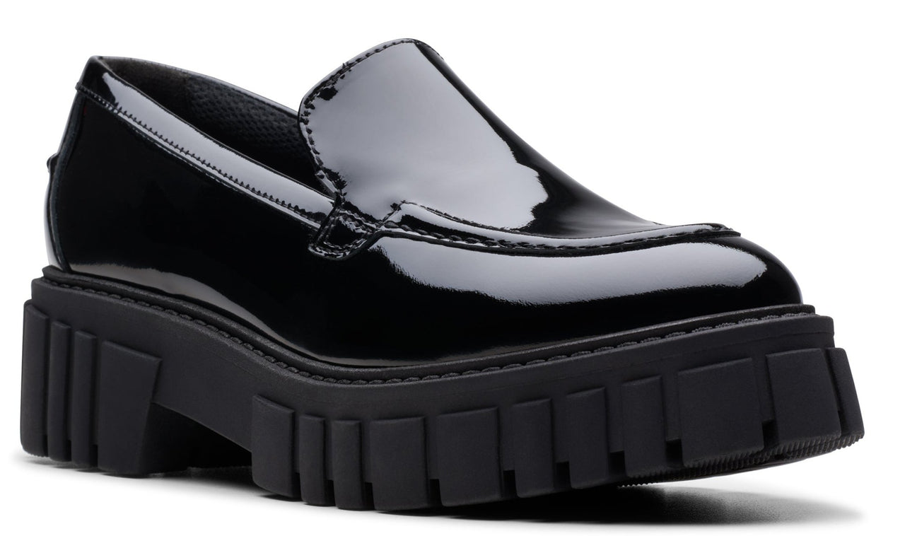 Black patent leather loafer with a chunky lug sole.