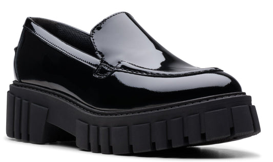 Black patent leather loafer with a chunky lug sole.