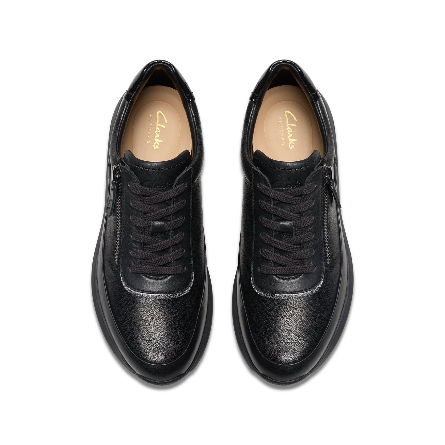 Top-down view of two black leather shoes with laces and zippers.