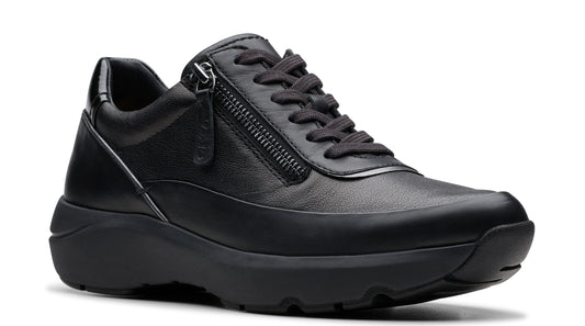 Black leather walking shoe with side zipper and low platform sole.
