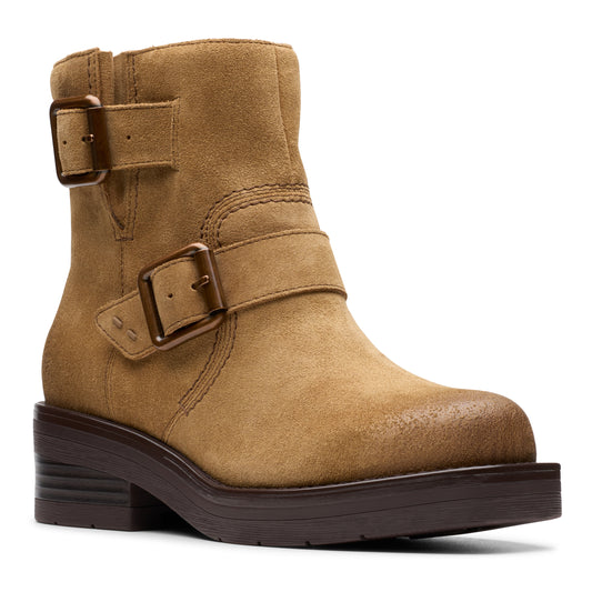 Tan suede ankle boot with two buckled straps and a chunky brown sole.