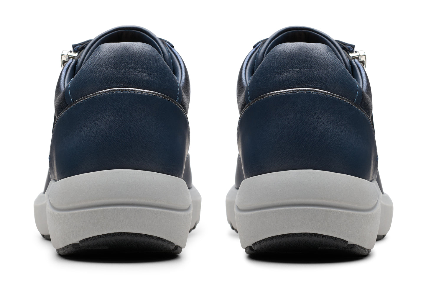 Back view of two navy sneakers with white platform soles.