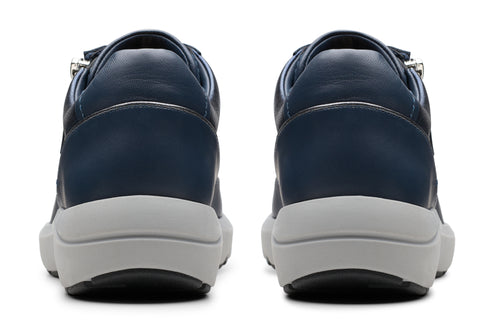 Back view of two navy sneakers with white platform soles.